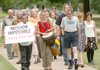Dick Bennett, center right, marches for peace. Bennett co-founded the Omni Center for Peace, Justice and Ecology 10 years ago, the spring before the attacks of Sept. 11, 2001.
