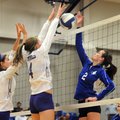 Rogers High School’s Emily Osborne attempts to hit the ball past Shannon Airola and Taylor Hightower...