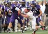 Alex Brignoni, Fayetteville’s junior free safety, carries the ball along the sideline after making an interception as Russellville senior running back Kendall Bond attempts to make the tackle during play at Harmon Field in Fayetteville.
