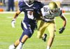 Justin Sunde of Greenwood breaks a tackle for a first half TD.