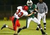 Episcopal Collegiate running back Del’Juan Johnson (3) tries to get past Benton Harmony Grove defender Nick Johnson during Friday’s game in Little Rock.