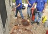 Shane Pullum, from left, Brian Schuchmann and Dennis Hicks work on a foundation at a home in Bella Vista. A wet spring has brought an increase in foundation problems, said Mike Herring, owner of American Standard Foundation Repair.
