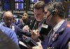 Traders work Friday on the floor of the New York Stock Exchange. 