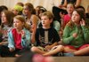 Tucker Elementary School
fourth-graders (photo right) Sydney Francoeur, 9, Thomas Cicatiello, 10, and Allyson Calico, 9, sing and pantomime along to a chant during a performance of Digging Up Arkansas. The play will tour Northwest Arkansas schools this fall before a statewide tour begins in the spring.

