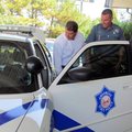 Troop L commander Capt. Lance King, from left, and Trooper Jesse Woodham, show the inside of a Highw...