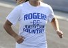 Carlee Rodriguez warms up for cross country practice on Wednesday at the Rogers High School track.