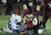 Har-Ber High's Jordan Kontz, bottom left, and Seth Gates tackle Springdale High quarterback Will Whatley at Jarrell Williams Bulldog Stadium during the cross-town game on Friday, Sept. 23, 2011. 