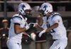 STAFF PHOTO J.S. WEDGEWORTH - Har-Ber High's Nick Byrne, left, is congratulated on a touchdown catch by teammate Michael Fine at Jarrell Williams Bulldog Stadium during the cross-town game against Springdale High on Friday, Sept. 23, 2011. 