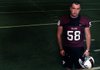 Emilio St. John, a senior defensive lineman, stands with his helmet before practice Thursday in the indoor fieldhouse at Springdale High School. St. John has been playing football since the fifth grade, originally starting off as on offensive lineman but later transitioned to playing both sides in the ninth grade, until he became a junior when he dedicated his time solely to playing defense.
