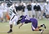 STAFF PHOTO ANDY SHUPE - Bentonville junior running back Tearris Wallace (29) fends off a tackle from Fayetteville senior cornerback Neil Watson on his way to the end zone Friday, Sept. 23, 2011, during the first half of play at Harmon Field. Go to photos.nwaonline.com to see more photos.