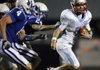 STAFF PHOTO MARC F. HENNING - Rogers' Joe Adams, left, and Bryan Gibby chase down Fort Smith Southside quarterback Austin Nolan during the first half of the Mounties' game Friday, Sept. 23, 2011, against the Rebels at Mountie Stadium in Rogers.