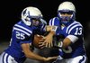 Rogers quarterback Nicky Wary, right, hands the ball off to fullback Ty Galyean during the Mounties’ game on Friday against Fort Smith Southside at Mountie Stadium in Rogers.

