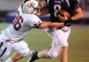 Staff Photo ANTHONY REYES - Fayetteville junior Austin Allen (8) pushes Springdale junior Clay Patrick off during the first half Friday Sept. 30, 2011 at Harmon Field in Fayetteville. Visit http://photos.nwaonline.com/ to see more photos.