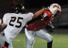 Bentonville Black’s Brian Gloeckler, left, reaches to try and tackle Ramay Indian’s Kenan Scales during the second half of play Thursday at Harmon Field in Fayetteville.
