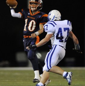 Preston Young, right, a Rogers linebacker, shown in the Mounties’ Sept. 30 game against Rogers Heritage, has been a standout in spring football, according to Rogers coach Shawn Flannigan.