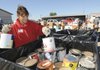 Benton County Circuit Judge Robin Green helps Saturday at the countywide cleanup. Tons of unwanted items from paint to pogo sticks were disposed of properly at the event held at the county Road Department.
