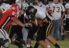 Daniel Schrock, Prairie Grove’s senior fullback, lowers his head against Farmington in a game played earlier this season. The Tigers will host Mena on Friday in a first round Class 4A state playoff game.