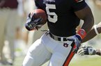 FILE - In this Sept. 10, 2011, file photo, Auburn Tigers running back Michael Dyer (5) runs for yardage in the first half of an NCAA college football game against Mississippi State in Auburn, Ala. The paths of South Carolina's Marcus Lattimore and Auburn's Mike Dyer cross again. The two star tailbacks, both heavily recruited by Auburn, meet for the third time. (AP Photo/Dave Martin, File)