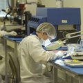 Austin Nelson, right, and Herman Joiner work Tuesday in a lab at Arkansas Power Electronics Internat...