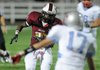Springdale High’s Rahmond Taylor stares down Fort Smith Southside’s Clayton Pankey as Taylor runs downfield Friday at Jarrell Williams Bulldog Stadium in Springdale.
