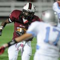 Springdale High’s Rahmond Taylor stares down Fort Smith Southside’s Clayton Pankey as Taylor runs do...
