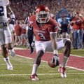 University of Arkansas receiver Joe Adams breaks away from the Auburn defense to score a touchdown i...