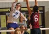 Shannon Airola, left, of Fayetteville tries to strike the ball past Mariah King of Springdale High on Tuesday at Springdale High School. Fayetteville won the match in a three-set sweep.