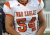 Max Hotelling, Rogers Heritage senior center, participates in team warm-ups before the War Eagles’ game Oct. 7 against Bentonville at Tiger Stadium in Bentonville.