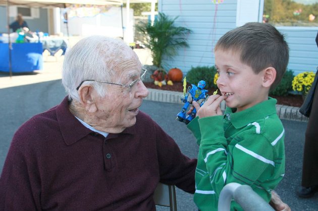 arkansas-democrat-gazetterick-mcfarland-101511-william-f-laman-former-north-little-rock-mayor-talks-with-dillon-leicht-of-conway-his-great-grand-nephew-about-his-missing-front-teeth-at-the-50th-anniversary-celebration-for-the-north-little-rock-animal-shelter-in-burns-park-saturday-he-was-mayor-and-instrumental-in-getting-the-shelter-built-50-years-ago