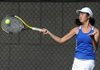 Tiffany Tang, Rogers High sophomore, returns a volley during the 7A state tennis tournament on Monday at the Billingsley Tennis Complex on the University of Arkansas campus in Fayetteville.