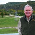 Kirk Dupps of Eureka Springs stands near the site of a proposed trout hatchery along the White River...