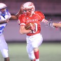 Garrett Wuehler of Fayetteville Ramay carries the ball past Rogers High freshman defender Bryan Harr...