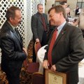 Jonathan Snyder, left, Fayetteville police detective, talks Wednesday with John Threet, Washington C...