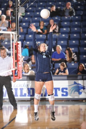 Kelsey Odell, a Springdale Har-Ber senior setter, sets the ball Tuesday during play against Springdale High at Wildcat Arena at Har-Ber High in Springdale. Odell has become a vocal leader for the Lady Wildcats.
