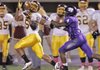 News Times/Michael Orrell -- Lake Hamilton's Dre Bennett (5) hauls in a pass as El Dorado's Vicent Pierce tries to make a play in the first half at Memorial Stadium in El Dorado on Friday. 
