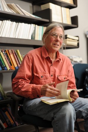 University of Arkansas professor Lynne Spellman smiles as she reads from her book, “Unbolting the Dark, a Memoir,” which was published in July.
