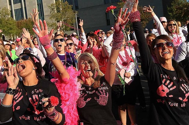 susan-g-komen-race-for-the-cure-participants-cheer-after-finishing-the-race-in-downtown-little-rock-the-board-of-the-arkansas-komen-affiliate-said-that-the-decision-to-pull-planned-parenthood-grants-for-breast-screenings-was-made-at-komen-headquarters-without-input-from-affiliates