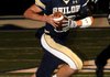 Drew Tyler, Shiloh Christian quarterback, runs to the outside Friday while looking for open receivers in the game against Gravette in Springdale.
