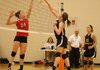 Gravette junior Nicole Springer hits one just over the net against Farmington's Lexie Lewis in tournament play on Oct. 18. Gravette senior Shyanne Nichols awaits a possible return.