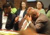 Raymond Robert Lee Douglas (left) and his attorney, Ronald Davis Jr., react Wednesday in Fayetteville to the jury’s acquittal of Douglas in the death of 65-year-old Goldie Thornsberry. 