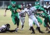 STAFF PHOTO ANDY SHUPE -- Greenland junior quarterback Darian Froud (1) carries the ball through the Lincoln defense Friday, Oct. 28, 2011, during the first half of play at Jonathan Ramey Memorial Stadium in Greenland.