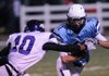 STAFF PHOTO SAMANTHA BAKER -- Springdale Har-Ber High School's Michael Fine, 11, evades a tackle by Fayetteville High School's Casey Perry, 10, Friday, Oct. 28, 2011 at Jarrell Williams Bulldog Stadium in Springdale.