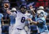 Austin Allen, left, Fayetteville quarterback, tosses the ball before Springdale Har-Ber’s Seth Gates can tackle him Friday at Jarrell Williams Bulldog Stadium in Springdale. Allen was hit several time during that game, but plans to play in the season finale instead of resting for the playoffs.