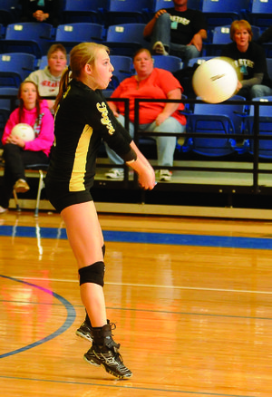 Bentonville's Emily Bruce digs into a Fayetteville serve in the first game of the finals of the 7A State Volleyball Championships at Buzz Bolding Arena at Conway High School in Conway, Ark. Saturday, Oct. 29, 2011.