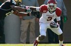Arkansas Democrat-Gaztte/RICK MCFARLAND - 10/29/11 - Arkansas Joe Adams stiff arms Vanderbilt Archibald Barnes in the 2nd q at Vanderbilt Stadium in Nashville, Tenn., on Oct. 29, 2011.