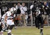 Bentonville’s Tearris Wallace runs Friday to get around Springdale High defender Henry Hernandez at Tiger Stadium in Bentonville.