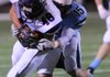 Springdale Har-Ber’s Luke Hanson tackles Fayetteville’s Billy McEver on Friday in Jarrell Williams Bulldog Stadium in Springdale. Har-Ber defeated Fayetteville 45-24 to set up a key showdown this week with No. 1 Bentonville for the 7A-West Conference title.
