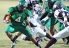 Michael Lewis, left, a Greenland senior running back, carries the ball through the Lincoln defense last Friday at Jonathan Ramey Memorial Stadium in Greenland. Both teams are battling for playoff seedings as they take the field Friday in the regular season finale.