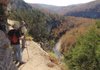 Denis Dean, left, and Jim Warnock savor the panorama high above the Buffalo National River during a hike on Saturday along the Goat Trail. The path leads hikers along Big Bluff some 300 feet above the water.