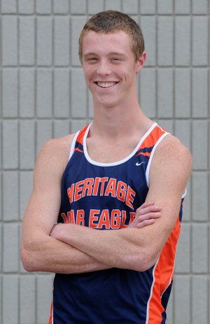 Senior Justin Miller smiles before practice Wednesday outside of the fieldhouse at Rogers Heritage High School.